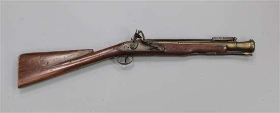 A late 18th century flintlock blunderbuss with sprung bayonet and brass barrel, 29in.